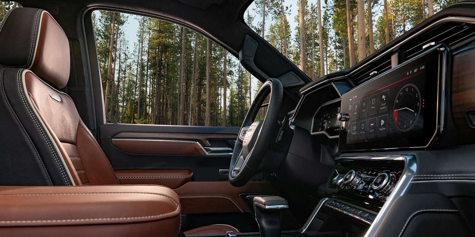 Sierra Crew Cab interior with spacious front seats and a large centre touchscreen